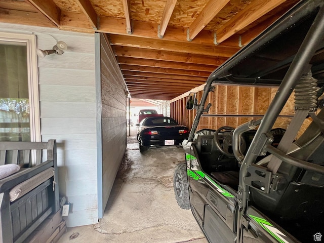 view of parking with a carport