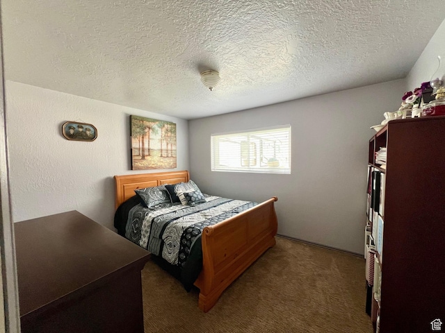 carpeted bedroom with a textured ceiling