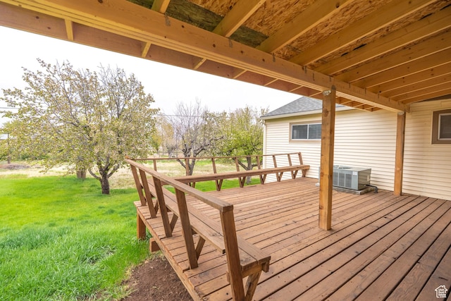 wooden deck with central AC unit and a lawn
