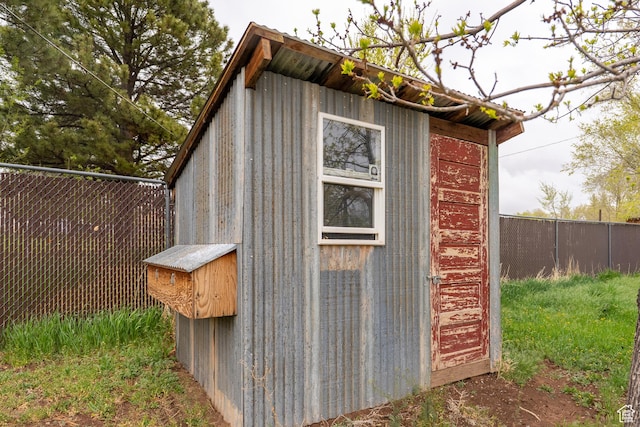 view of shed with a fenced backyard