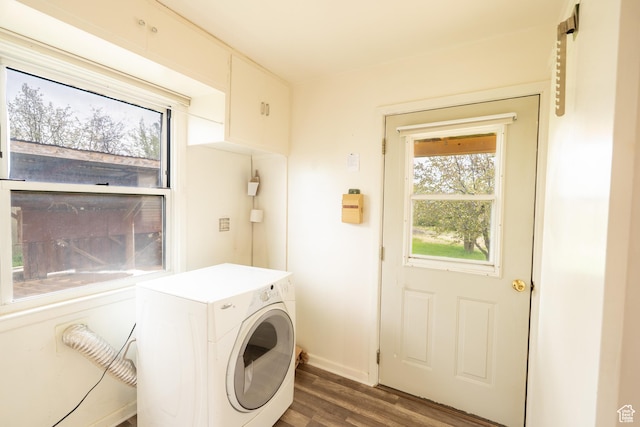 laundry area featuring washer / clothes dryer, laundry area, and dark wood-type flooring