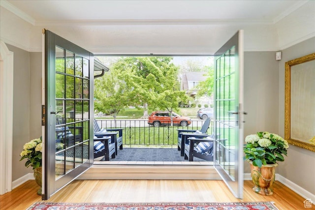 1704 E Herbert Ave, Salt Lake City, UT 84108 - doorway with wood finished floors, baseboards, and ornamental molding