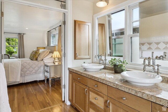 1704 E Herbert Ave, Salt Lake City, UT 84108 - ensuite bathroom featuring a sink, double vanity, ensuite bathroom, and wood finished floors