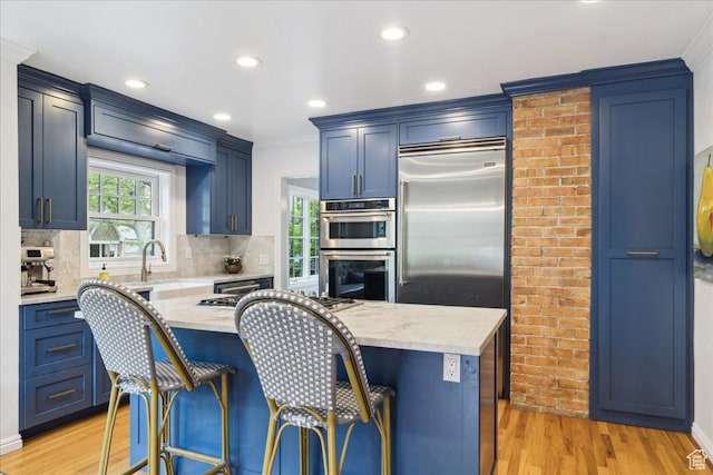 1704 E Herbert Ave, Salt Lake City, UT 84108 - kitchen featuring a sink, crown molding, decorative backsplash, and double oven