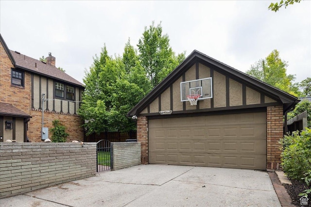 1704 E Herbert Ave, Salt Lake City, UT 84108 - garage featuring driveway, a gate, and fence