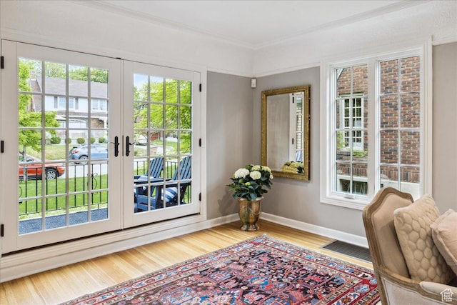 1704 E Herbert Ave, Salt Lake City, UT 84108 - doorway to outside featuring french doors, baseboards, visible vents, crown molding, and wood finished floors