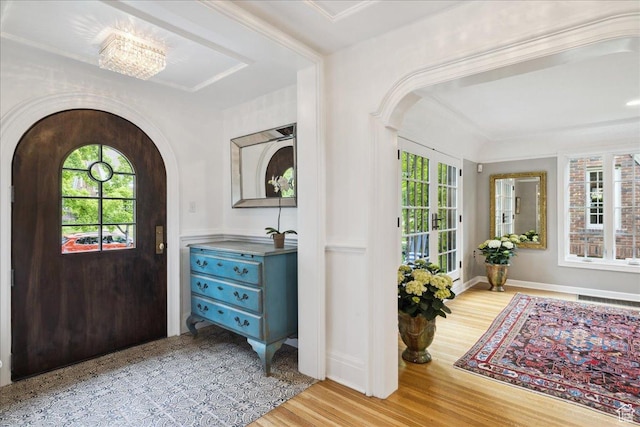 1704 E Herbert Ave, Salt Lake City, UT 84108 - foyer featuring a wealth of natural light, arched walkways, visible vents, and wood finished floors
