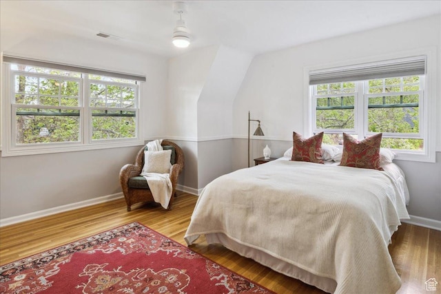 1704 E Herbert Ave, Salt Lake City, UT 84108 - bedroom featuring multiple windows, visible vents, and wood finished floors