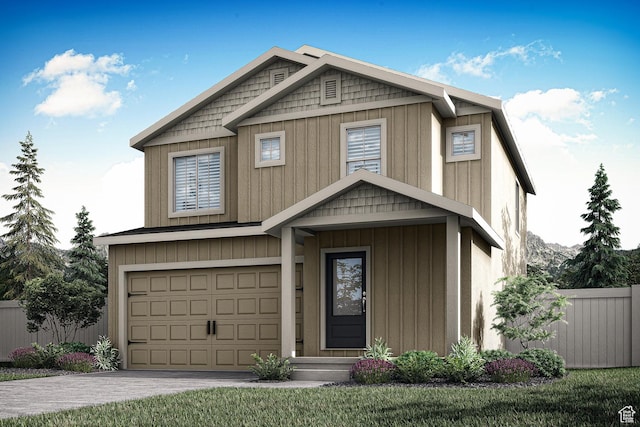 craftsman-style home with driveway, fence, and a garage