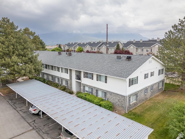 birds eye view of property with a residential view
