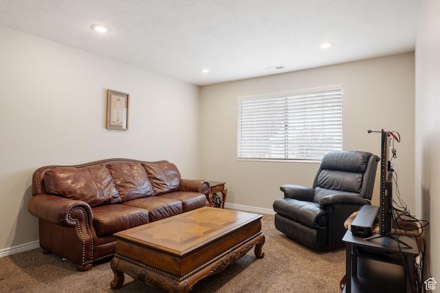 living room featuring carpet flooring, visible vents, baseboards, and recessed lighting