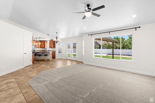 635 N 460 E, Ephraim, UT 84627 - unfurnished living room featuring light tile patterned flooring, baseboards, and a healthy amount of sunlight