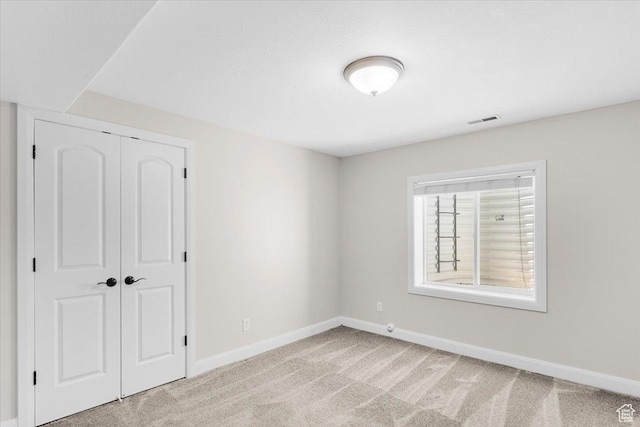 635 N 460 E, Ephraim, UT 84627 - unfurnished bedroom featuring baseboards, light carpet, a closet, and visible vents