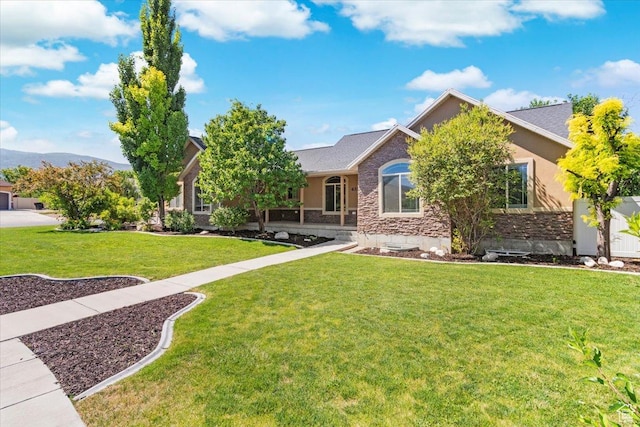 635 N 460 E, Ephraim, UT 84627 - view of front facade featuring stone siding, stucco siding, and a front lawn