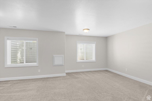 635 N 460 E, Ephraim, UT 84627 - unfurnished room with baseboards, light carpet, and a healthy amount of sunlight