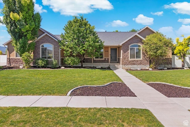 635 N 460 E, Ephraim, UT 84627 - ranch-style house featuring stone siding, roof with shingles, and a front lawn