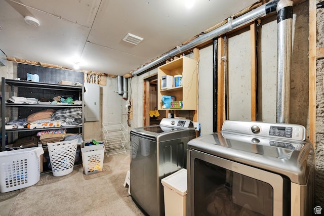 washroom with light carpet, laundry area, washing machine and dryer, and visible vents
