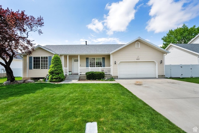 ranch-style house featuring a porch, fence, an attached garage, concrete driveway, and a front yard