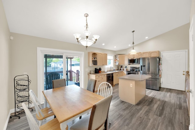 dining area featuring a notable chandelier, baseboards, light wood-style floors, lofted ceiling, and recessed lighting
