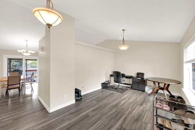 office featuring plenty of natural light, a chandelier, wood finished floors, and lofted ceiling