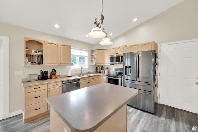 kitchen featuring open shelves, appliances with stainless steel finishes, a sink, and light brown cabinetry