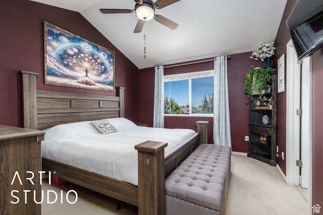 carpeted bedroom featuring a ceiling fan, baseboards, and lofted ceiling