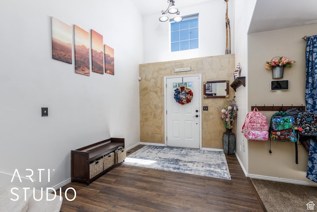 entrance foyer featuring baseboards and wood finished floors