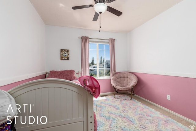 carpeted bedroom with baseboards and ceiling fan