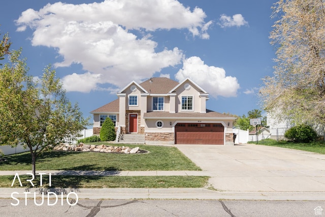craftsman-style home featuring fence, an attached garage, stucco siding, concrete driveway, and a front lawn