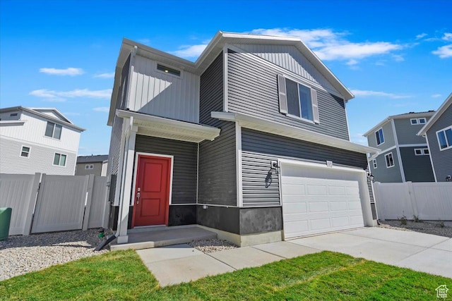 353 N Colonnade Rd Unit 1007, Saratoga Springs, UT 84045 - view of front of property featuring driveway, board and batten siding, a garage, and fence