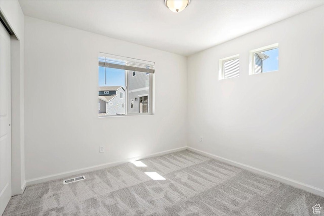 353 N Colonnade Rd Unit 1007, Saratoga Springs, UT 84045 - unfurnished bedroom featuring carpet floors, baseboards, a closet, and visible vents