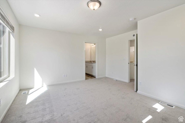 353 N Colonnade Rd Unit 1007, Saratoga Springs, UT 84045 - unfurnished bedroom featuring multiple windows, visible vents, and carpet floors