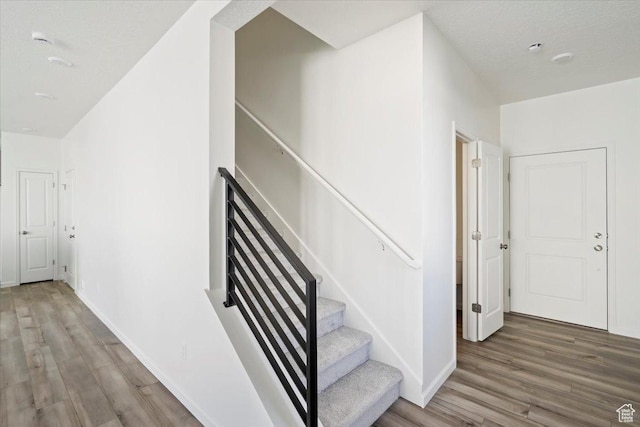 353 N Colonnade Rd Unit 1007, Saratoga Springs, UT 84045 - staircase featuring baseboards and wood finished floors