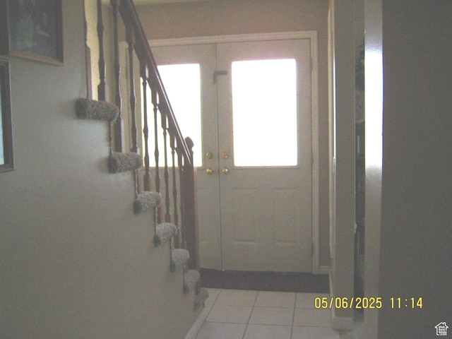 18235 N 4400 W, Fielding, UT 84311 - doorway to outside with tile patterned flooring, a healthy amount of sunlight, and stairs