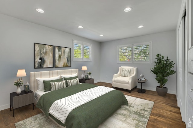bedroom with baseboards, recessed lighting, and wood finished floors