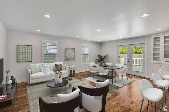 living area featuring wood finished floors, french doors, and recessed lighting