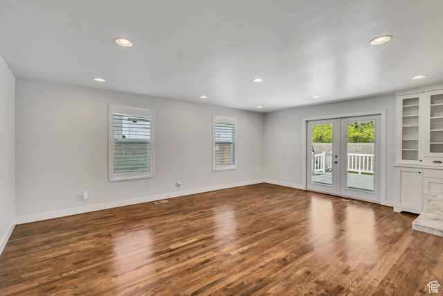 unfurnished room with dark wood-style flooring, french doors, and recessed lighting
