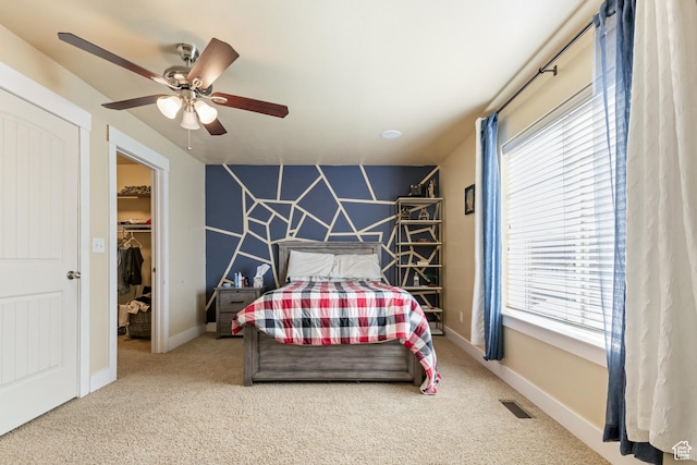 5140 S 3500 W, Roy, UT 84067 - carpeted bedroom featuring multiple windows, a spacious closet, ceiling fan, and visible vents