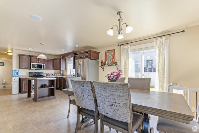 5140 S 3500 W, Roy, UT 84067 - dining area with light tile patterned floors, a notable chandelier, and recessed lighting