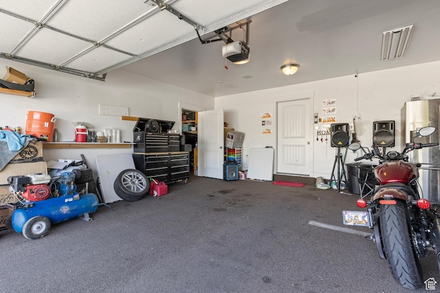 5140 S 3500 W, Roy, UT 84067 - garage featuring a garage door opener