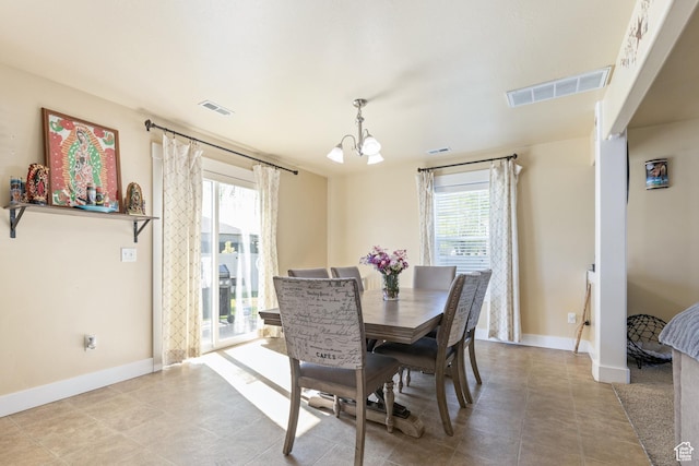 5140 S 3500 W, Roy, UT 84067 - dining space with an inviting chandelier, plenty of natural light, and visible vents