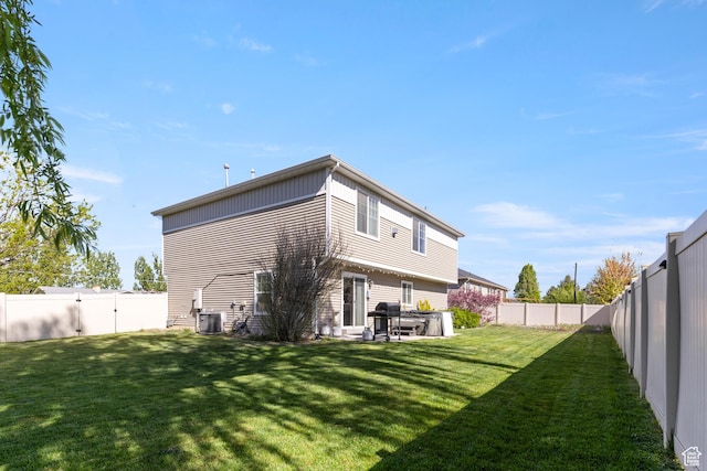 5140 S 3500 W, Roy, UT 84067 - rear view of property featuring central AC unit, a fenced backyard, and a yard
