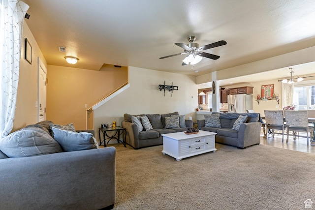 5140 S 3500 W, Roy, UT 84067 - living room with light carpet, ceiling fan with notable chandelier, and visible vents