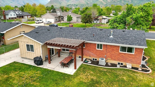 569 N 700 E, Mapleton, UT 84664 - back of property with a residential view, central AC, a pergola, a lawn, and board and batten siding