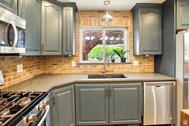 569 N 700 E, Mapleton, UT 84664 - kitchen with a sink, stainless steel appliances, backsplash, and light countertops