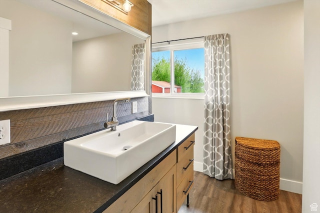 569 N 700 E, Mapleton, UT 84664 - bathroom featuring baseboards, vanity, and wood finished floors