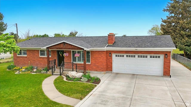 569 N 700 E, Mapleton, UT 84664 - ranch-style home with a chimney, driveway, brick siding, a garage, and a front yard