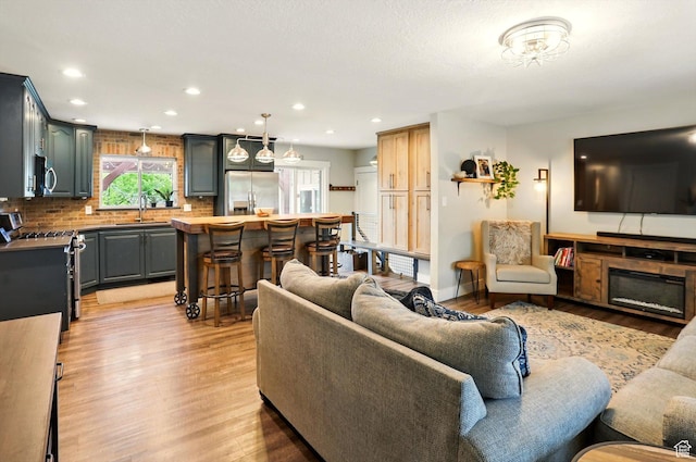 569 N 700 E, Mapleton, UT 84664 - living area with light wood finished floors and recessed lighting