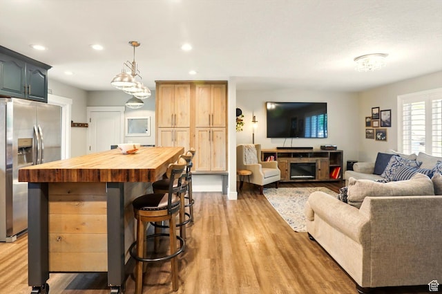 569 N 700 E, Mapleton, UT 84664 - living room featuring light wood-type flooring and recessed lighting