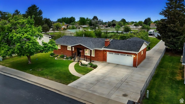 569 N 700 E, Mapleton, UT 84664 - ranch-style home featuring an attached garage, a chimney, a front yard, brick siding, and driveway